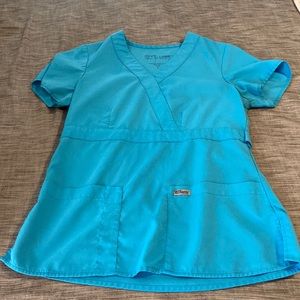 Greys Anatomy Coral Blue scrub top.